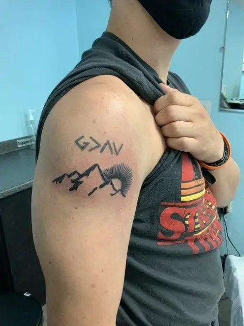 mountain tattoo on shoulder